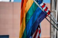 1619px-Rainbow_Flag_and_American_Flag_-_Gay_Pride_(28219386627)~3.jpg